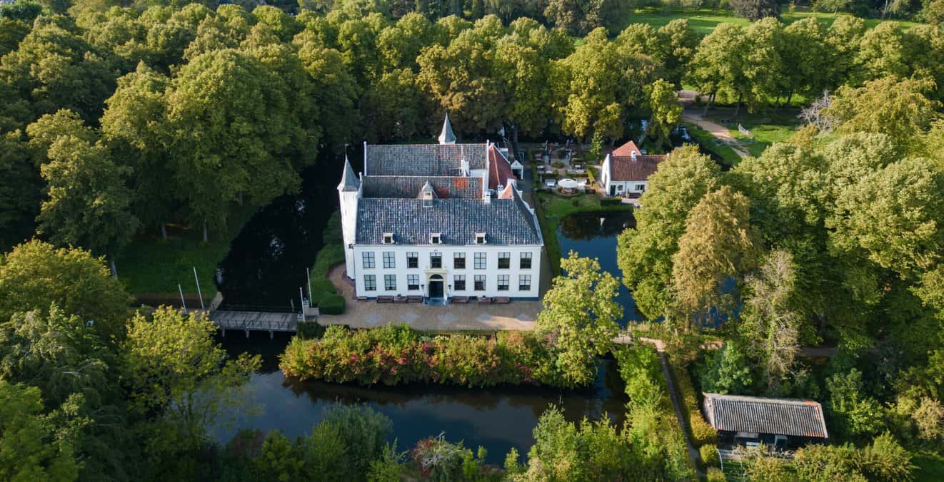 Image: Kasteel van Rhoon, surrounded by its lush estate grounds. Photo credit: Yara Dragt, courtesy of Het Kasteel van Rhoon.