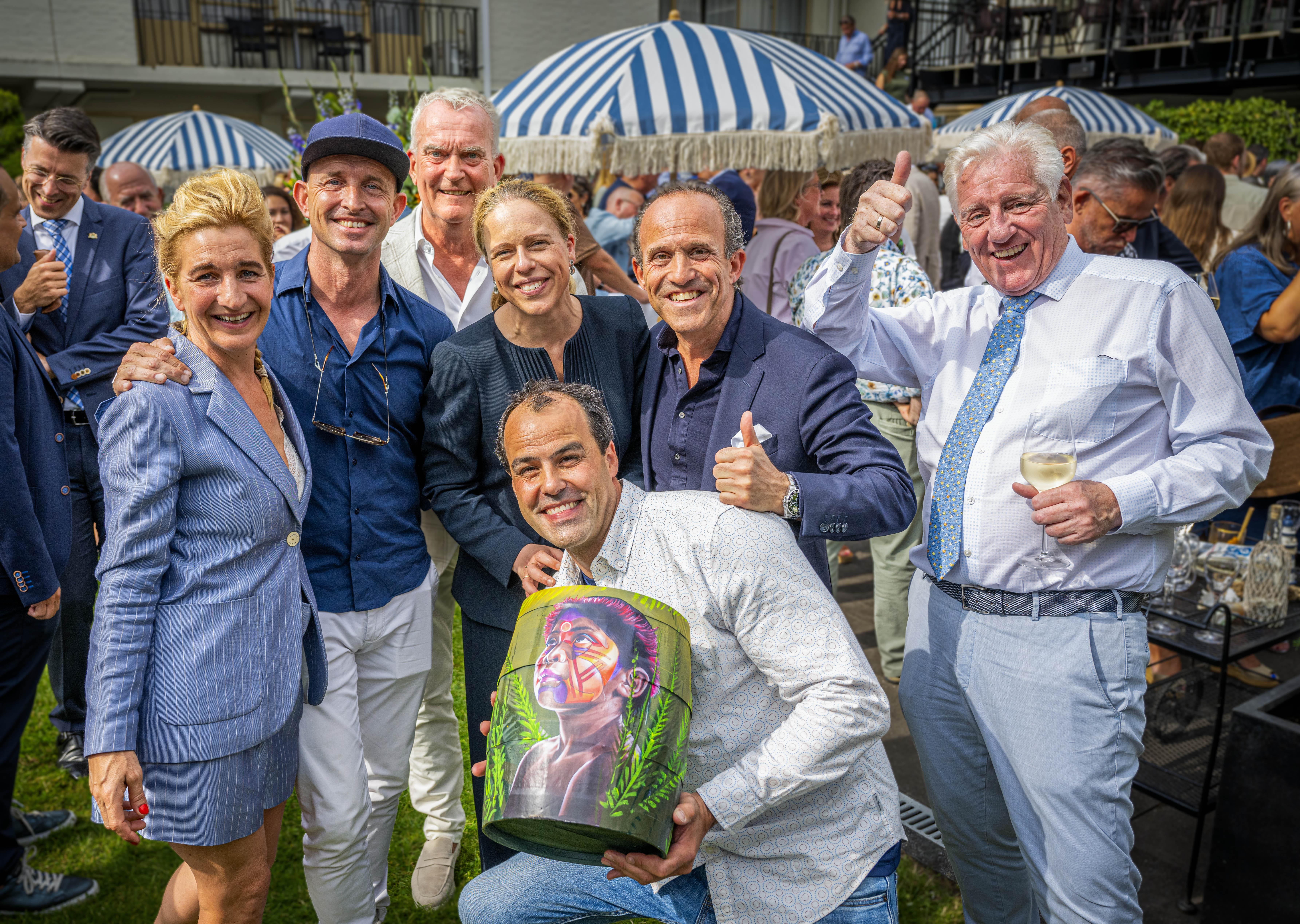 Huib Lloyd of Stichting Jarige Job receives art barrel at 30th Rotterdam Haringparty for his work supporting children in poverty across the Netherlands.