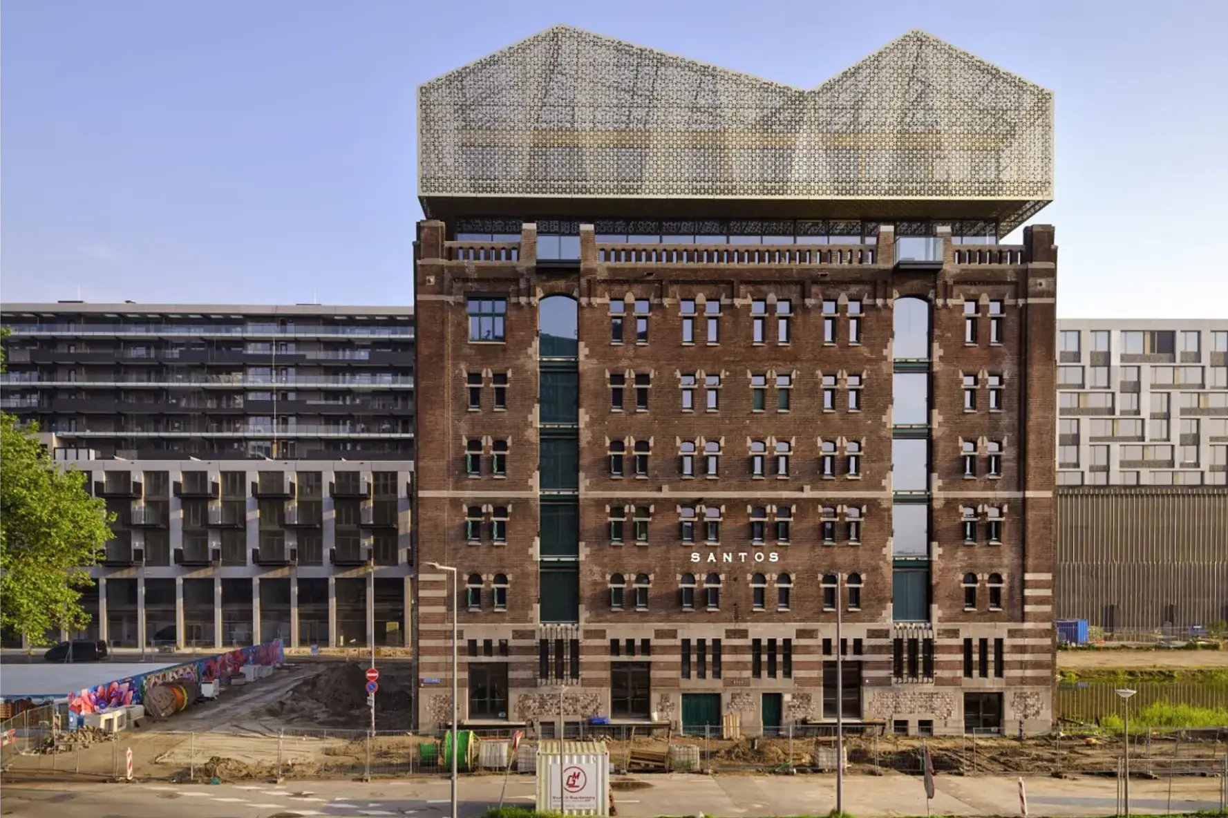 Nederlands Fotomuseum reopens on 7 February 2026 in Pakhuis Santos, Katendrecht, with exhibitions, visible restoration work, and rooftop skyline views.