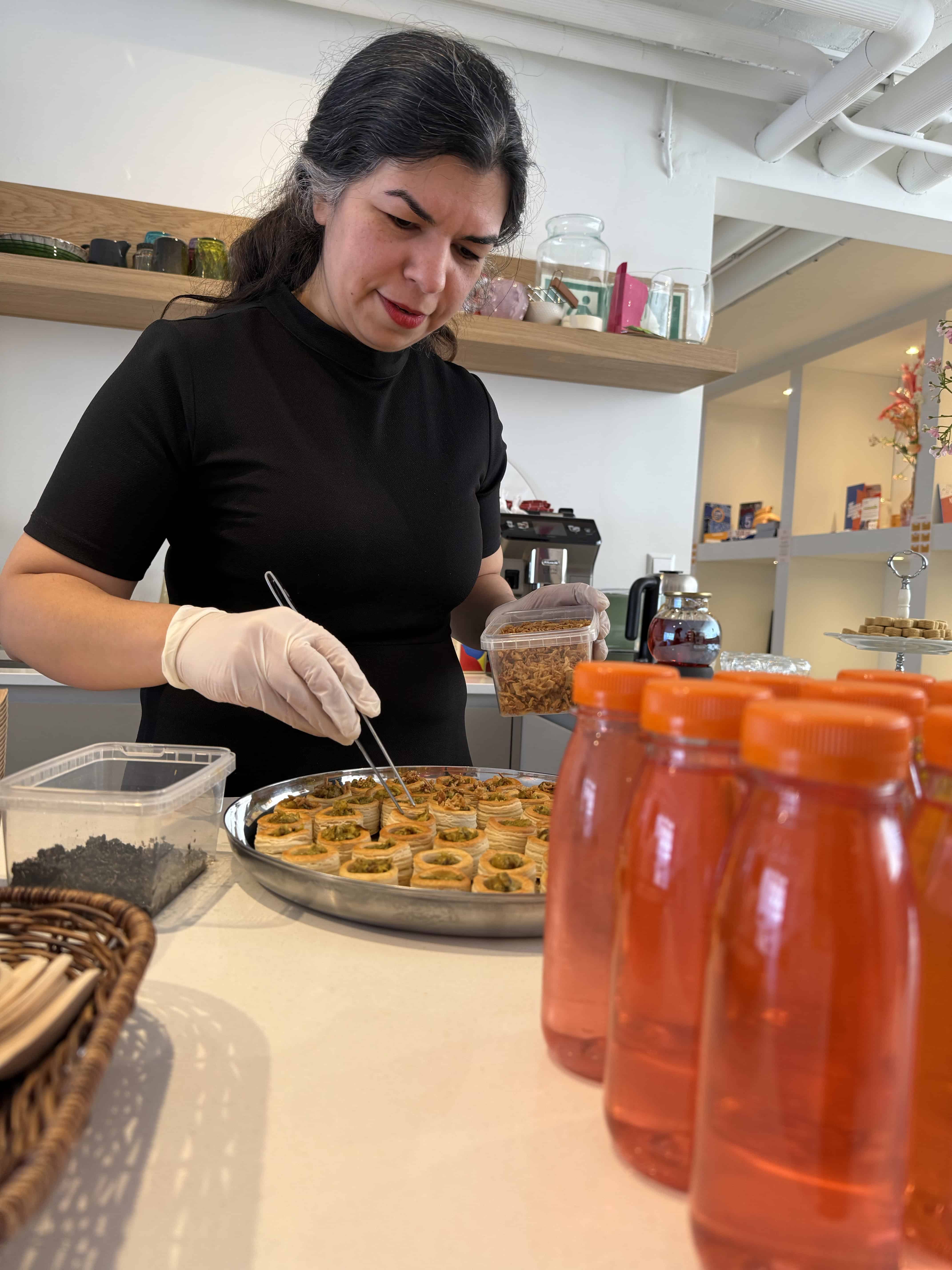 Zahra Navazi prepares food for a Persian Feast gathering.
